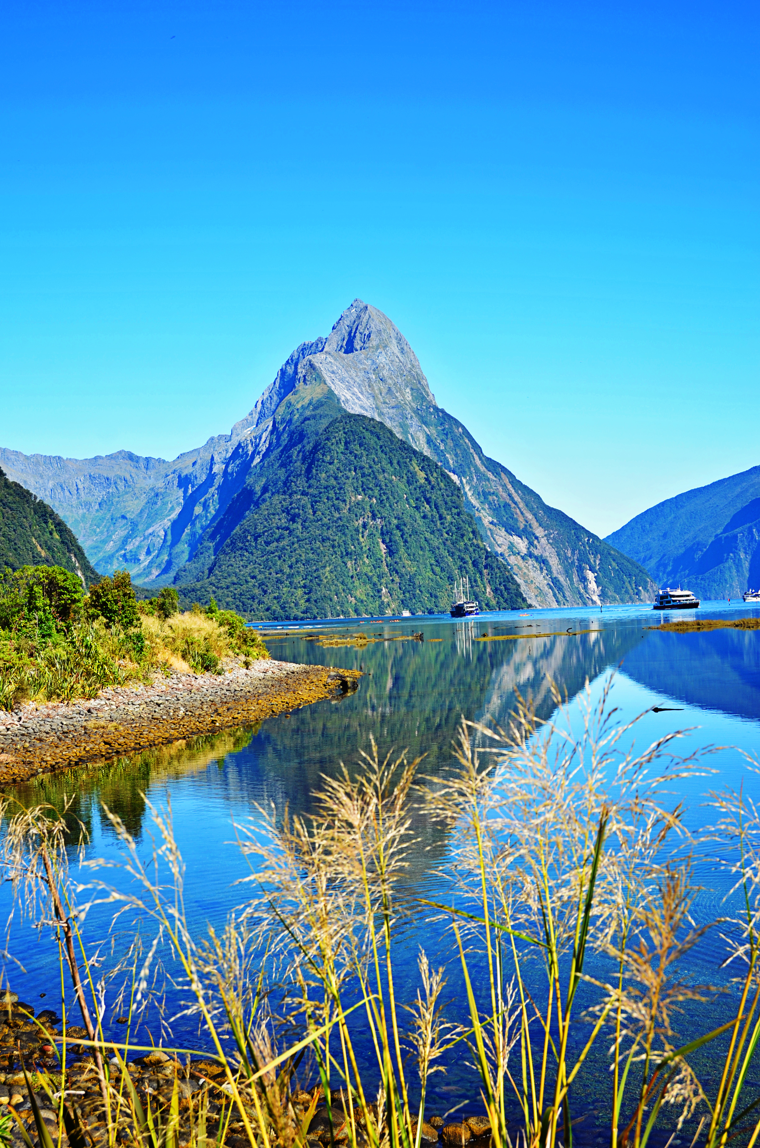 Mountain rising above a bright blue lake